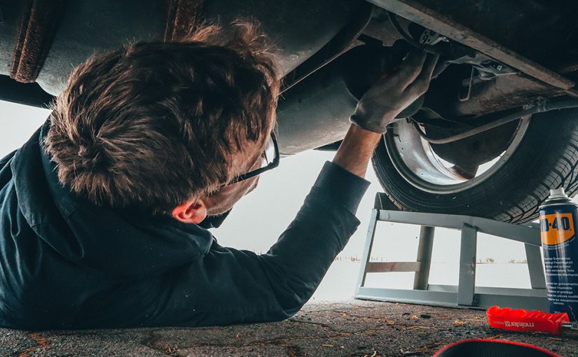 man-fixing-vehicle-engine-2244746-825x510